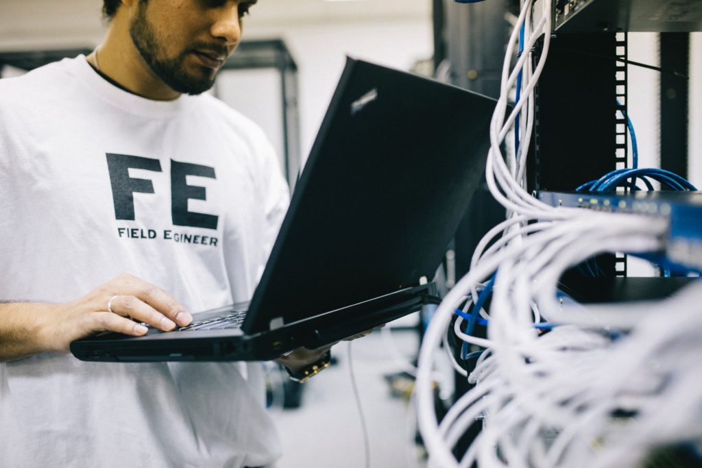 field engineer working on computer networking system